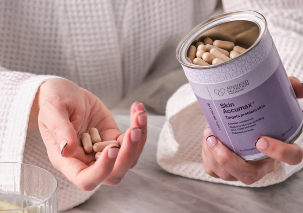 Person taking Advanced Nutrition Programme supplements