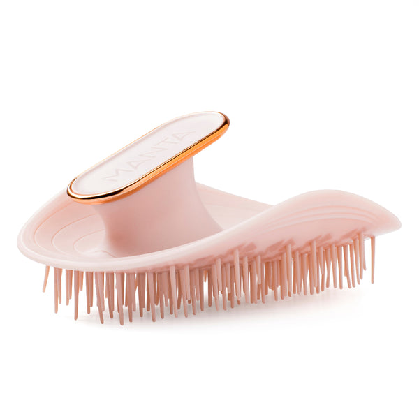 A pink Tangle Teezer hairbrush with a metallic rose gold trim around the handle and a white logo plate, shown on a clean white background.