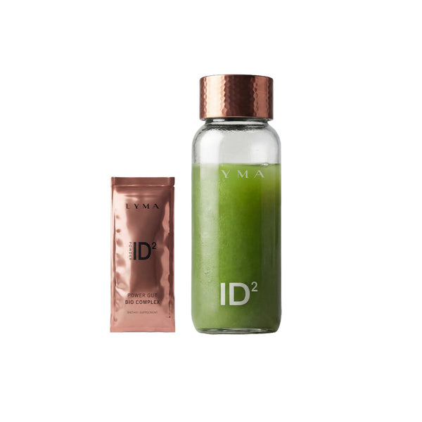 A clear glass bottle filled with green liquid and a metallic rose-gold packet labeled LYMA ID², shown on a plain white background.