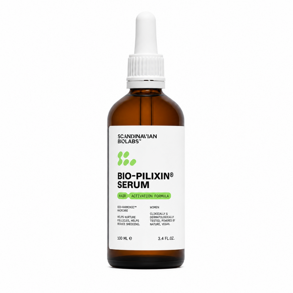 A 100 mL amber glass dropper bottle of Scandinavian Biolabs Bio-Pilixin Serum with a white label and white dropper cap, centered on a white background.