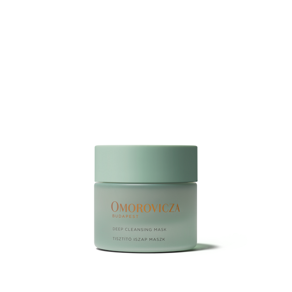 A single jar of Omorovicza Budapest Deep Cleansing Mask in a pale sage green color with gold lettering, centered on a clean white background.