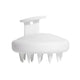 A white silicone scalp massager with a rounded head, short spiky teeth, and a curved handle with a small hanging hole, shown on a plain white background.