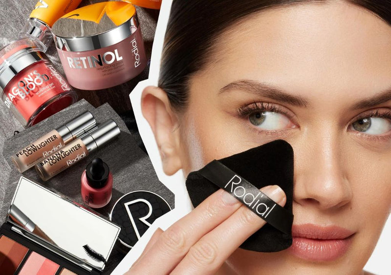 Lady applying rodial makeup surrounded by rodial beauty products