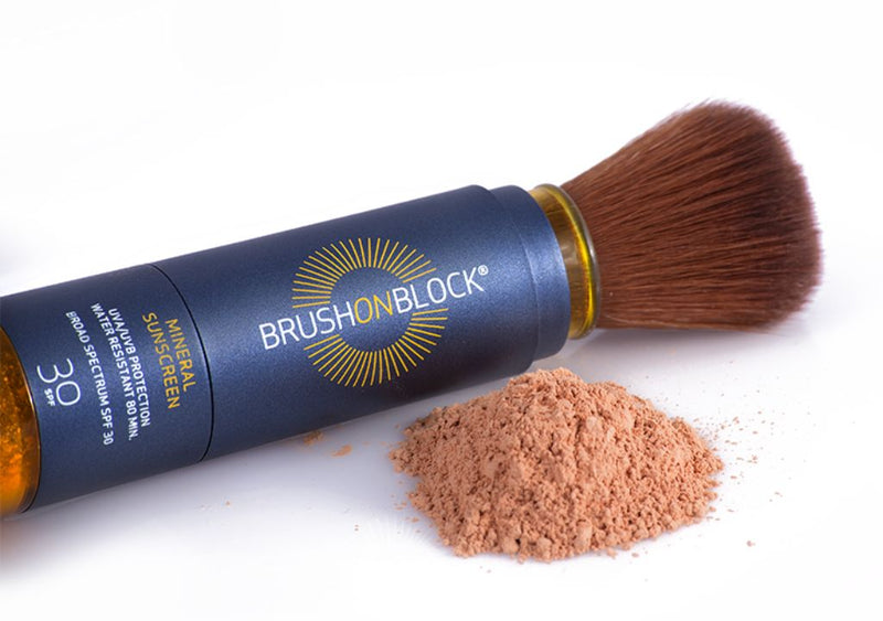 Brush On Block brush applicator with loose spf powder