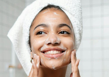teenage girl cleansing her face