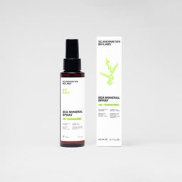 A bottle of Scandinavian Biolabs Sea Mineral Spray next to its white packaging box, featuring a minimalist green coral graphic and black text, set against a clean light gray background.