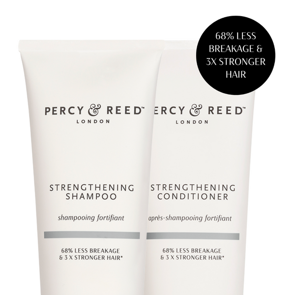 Two white tubes of Percy & Reed London haircare products, labeled Strengthening Shampoo and Strengthening Conditioner, with a black circular callout in the top right stating '68% Less Breakage & 3x Stronger Hair'.