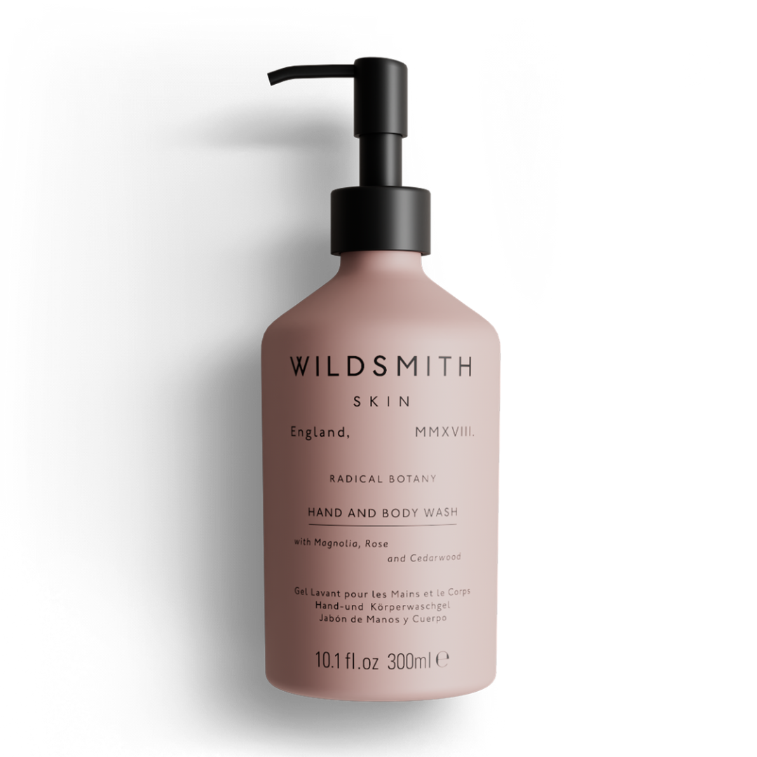 Pink bottle of Wildsmith Skin hand and body wash on a white background