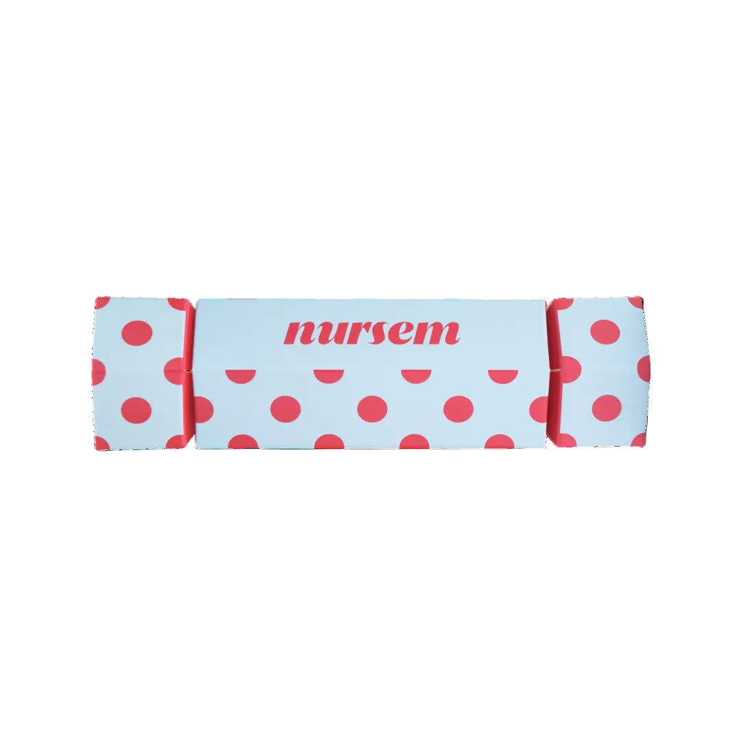 A light blue Christmas crackers with red polka dots and the word 'nursem' printed in red on the front, shown on a plain white background.