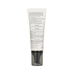 The back of a white squeeze tube with black text, featuring a dark gray pump dispenser, shown on a plain white background.