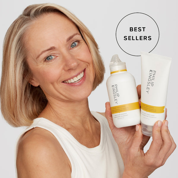 Woman holding two Philip Kingsley products with 'Best Sellers' text on a light gray background