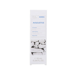 A tall, narrow white box for Korres Avgooust Eau De Toilette, featuring blue text and a graphic of white stones on a clean white background.