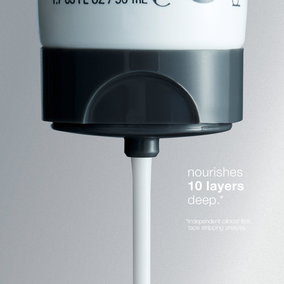 Close-up of a skincare product pump with text on a gray background