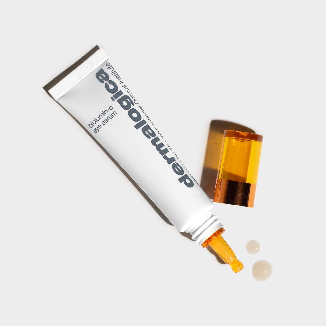 Dermatologic eye serum tube with dropper on a white background
