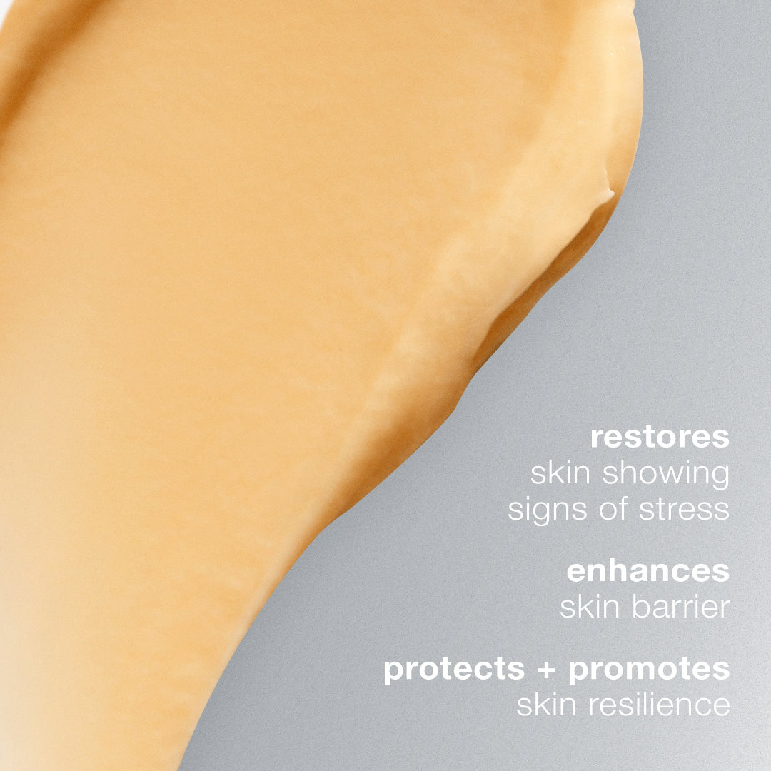 Close-up of a skincare product with text highlighting its benefits on a gray background