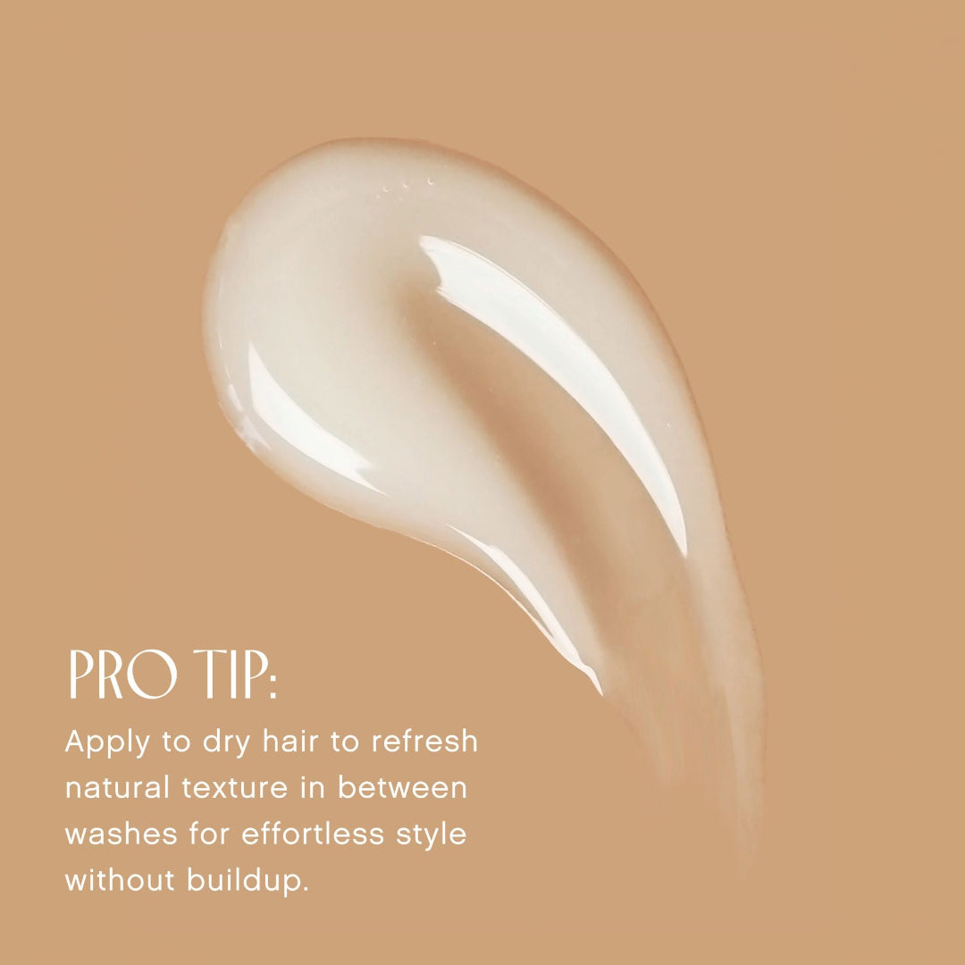 Beige hair product swatch with application tip on a beige background