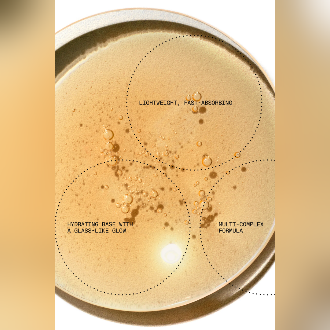 A close-up of a beige cosmetic or skincare cream with visible bubbles and overlaid text circles reading 'LIGHTWEIGHT, FAST-ABSORBING,' 'HYDRATING BASE WITH A GLASS-LIKE GLOW,' and 'MULTI-COMPLEX FORMULA.'.