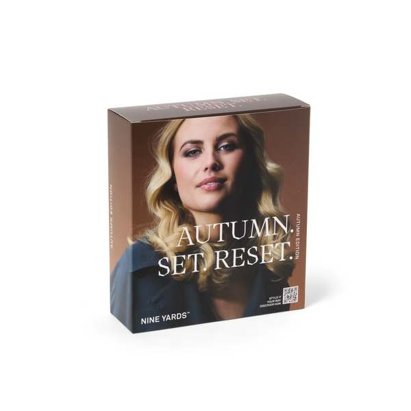 Nine Yards 'Autumn Set Reset' fragrance box featuring a portrait of a blonde woman on a brown background, shown at a three-quarter angle on a white studio background.