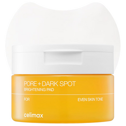 A bright yellow skincare pad container with a white lid, labeled 'PORE + DARK SPOT BRIGHTENING PAD' by celimax, on a white background.