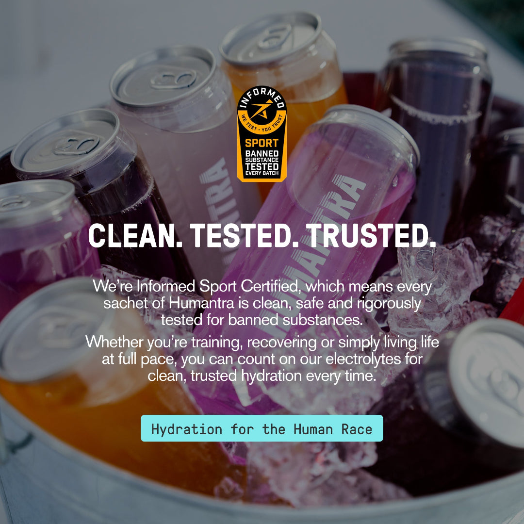 Cans of Humantra sports drink with certification label and promotional text.