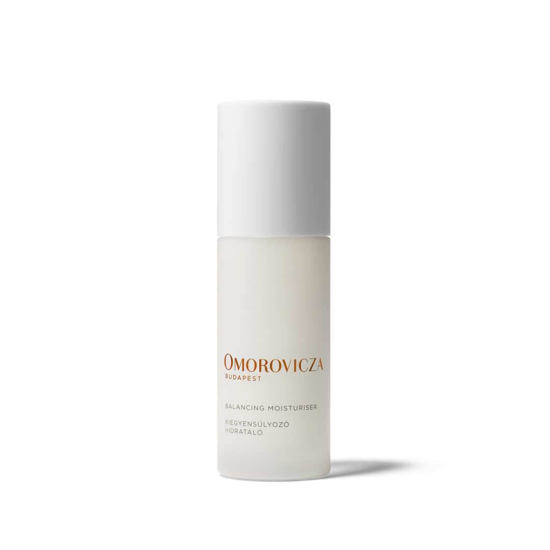 Omorovicza Skincare Balancing Moisturiser in a frosted glass bottle with a white cap, featuring gold and black text on a clean white background.