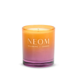Neom candle with gradient color on a white background