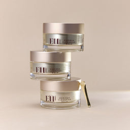 Three jars of Emma Hardie Moringa Cleansing Balm on a beige background