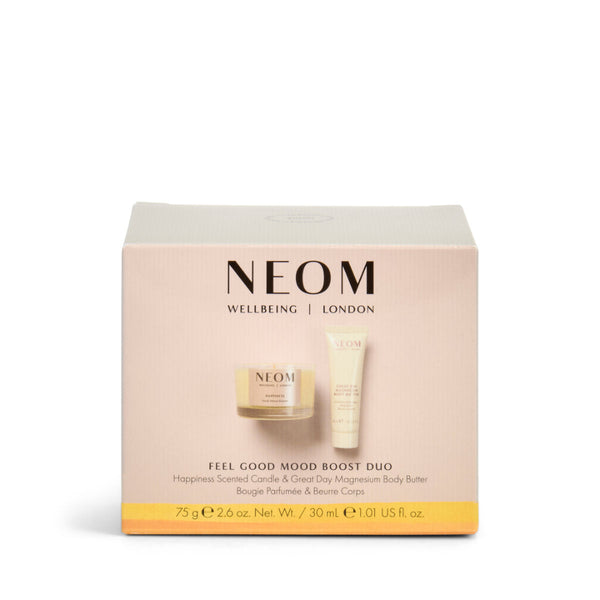 NEOM Wellbeing London Feel Good Mood Boost Duo gift set in a light beige box, featuring a jar of body butter and a tube of moisturizer, on a white background.