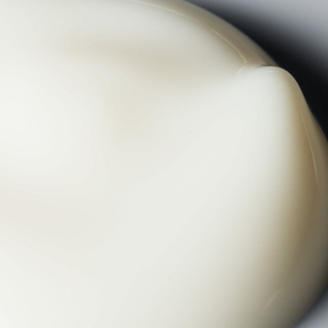 Close-up of a beige ceramic bowl with a blurred background