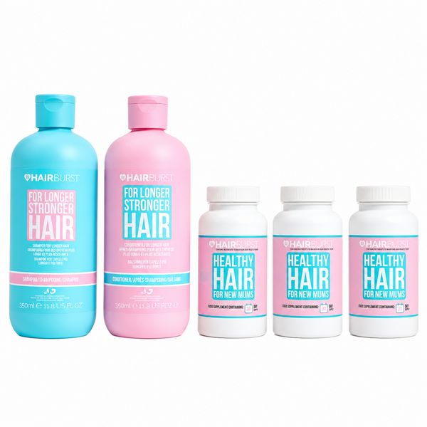 HairBlust hair care set including a light blue shampoo bottle, a pink conditioner bottle, and three white supplement bottles with pink and blue labels, arranged on a white background.