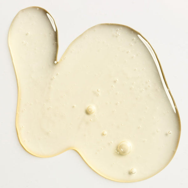 White gel-like substance on a light gray background