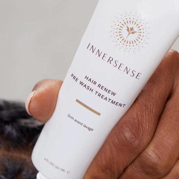 Innersense Hair Renew Pre-Wash Scalp Treatment held in a hand