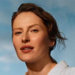 Woman with a light blue sky background