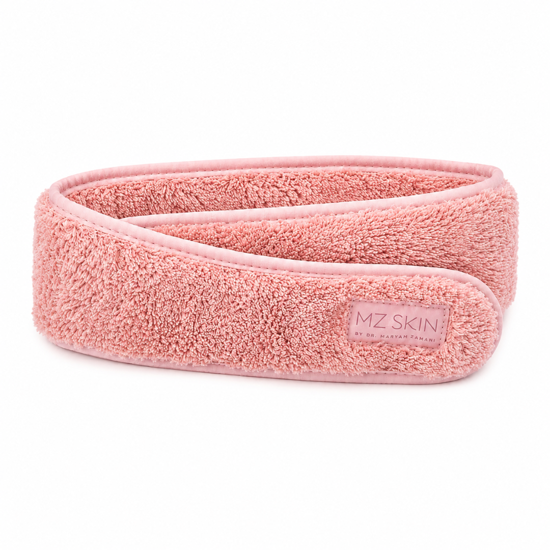 A pink textured terry cloth hair wrap headband with a small rectangular brand label reading 'MZ SKIN' on a clean white background.
