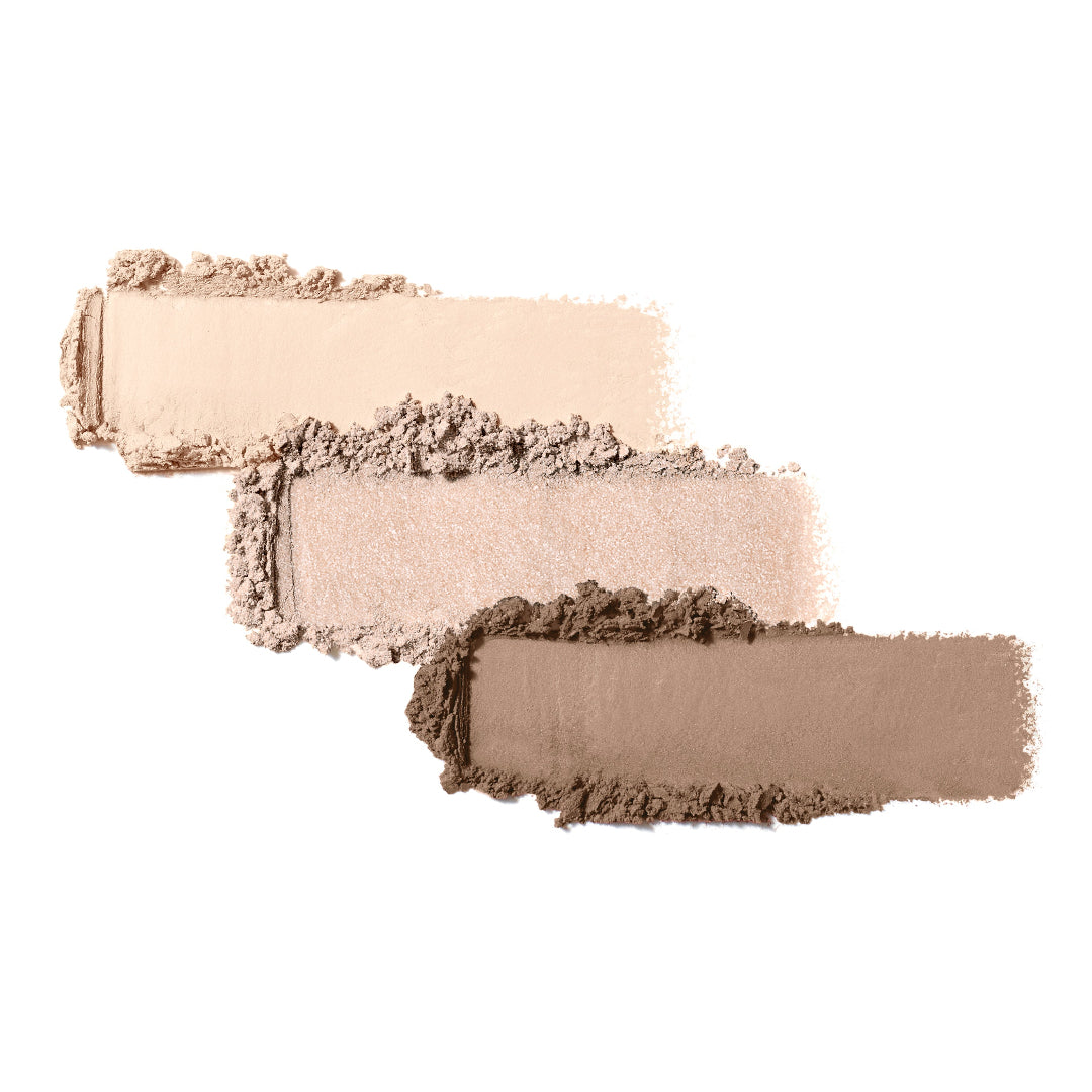 Three makeup swatches in beige, brown, and gray on a white background