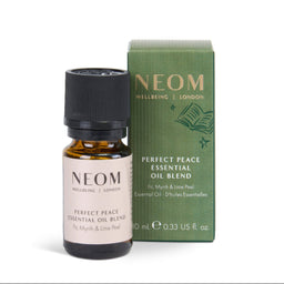 NEOM Wellbeing Essential Oil Blend 'Perfect Peace' in a 10 ml amber glass bottle with a black cap, shown next to its green cardboard packaging box on a white background.