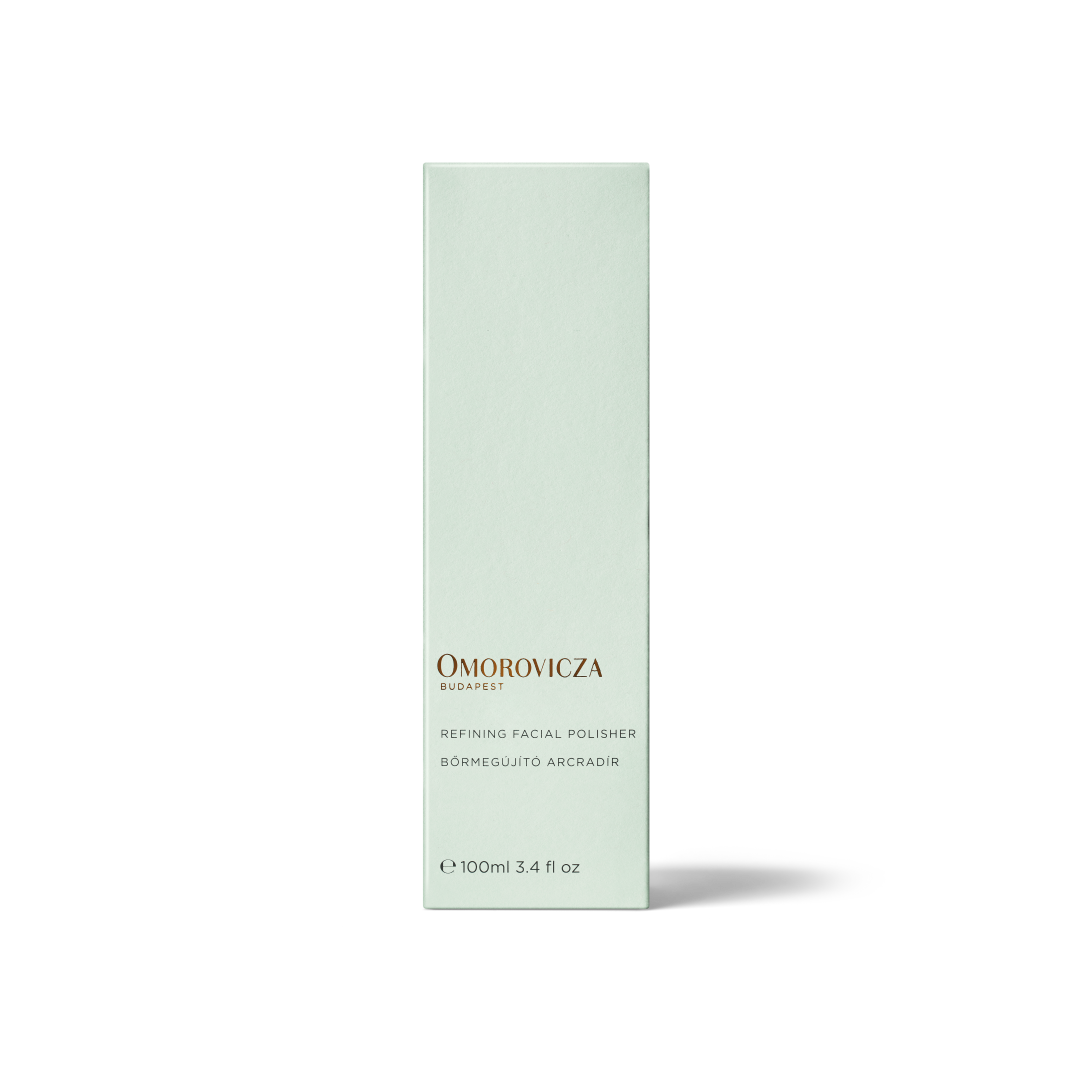 A tall, slender pale mint green box for Omorovicza Bio系列 Refining Facial Polisher, shown on a clean white background with a soft shadow.