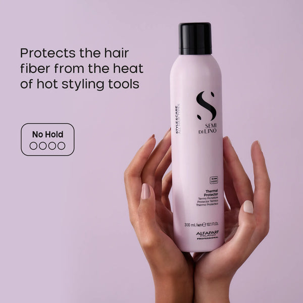 Hand holding a bottle of Alfaparf Semi Di Lino hair product against a light purple background