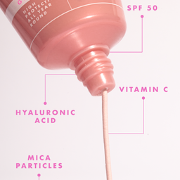 Pink skincare serum bottle with text highlighting ingredients on a white background