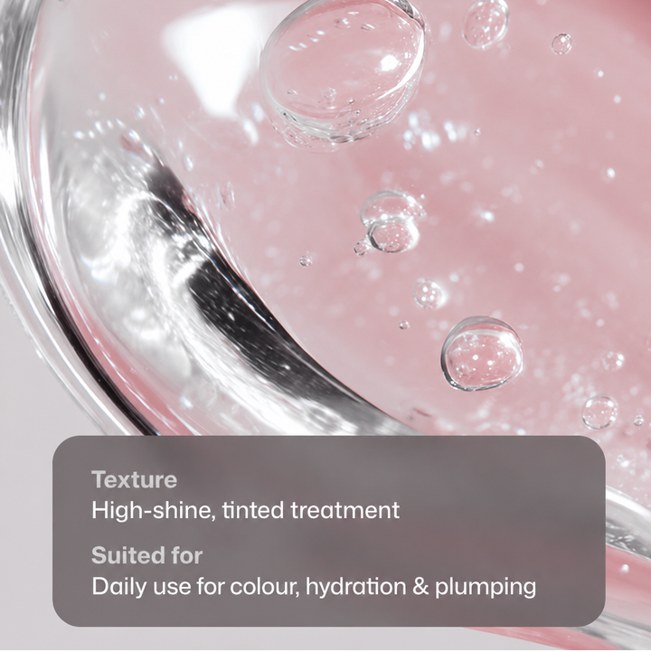 Close-up of a pink cosmetic treatment in a clear glass container with visible bubbles and text overlay describing the high-shine tinted texture and suitability for daily use.