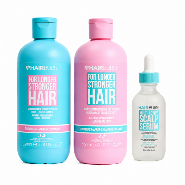 Three HAIRBURST hair care products on a white background: a large turquoise shampoo bottle, a large pink conditioner bottle, and a smaller white scalp serum bottle with a turquoise dropper cap.