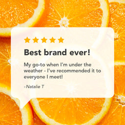 A promotional graphic with a white rounded speech-bubble style card over a background of sliced orange fruit. The card contains a five-star rating and a quote: 'Best brand ever! My go-to when I'm under the weather - I've recommended it to everyone I meet! -Natalie T'.