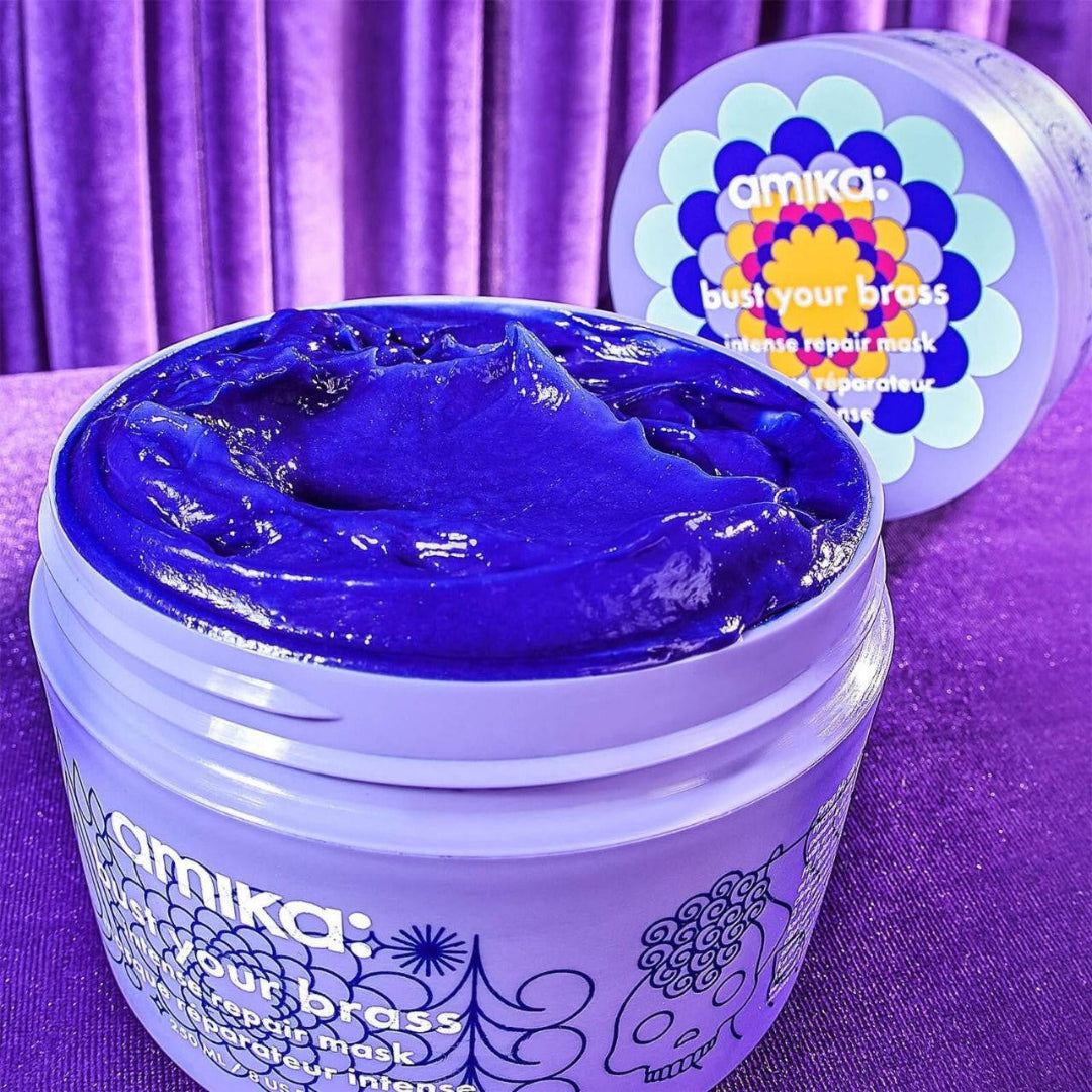 Amika hair product jar with purple lid and purple background
