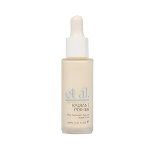 Skincare serum bottle with dropper labeled 'et al.' on a white background