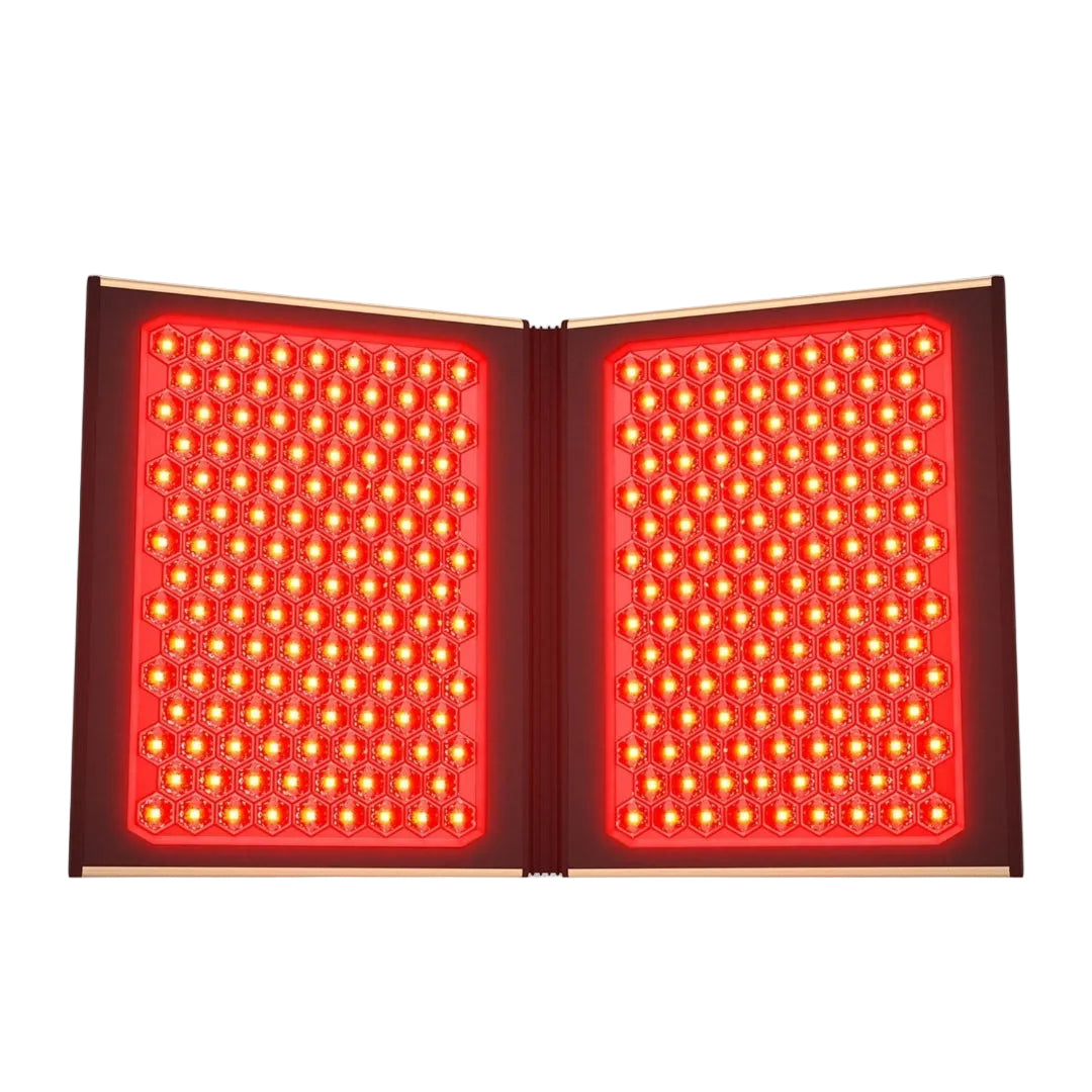 An open red light therapy panel with two large rectangular grids of glowing red LEDs, shown against a plain white background.