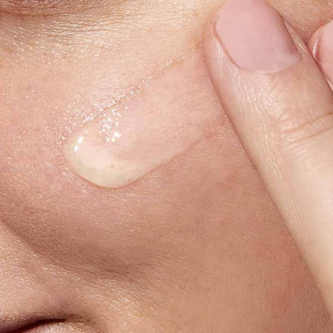 Model applyign CeraVe Resurfacing Retinol Serum with Ceramides & Niacinamide for Blemish-Prone Skin 30ml to their face