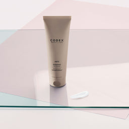 Codex Labs Antu Refreshing Gel Cleanser tube on a glass slate