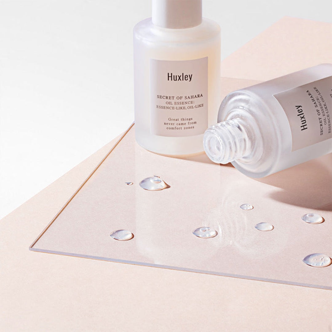 drops of Huxley Oil Essence; Essence-like, Oil-like on a glass surface