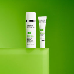 Salicylic acid spot gel tube and clarifying gel moisturiser on large green cube